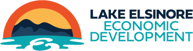 Logo for Lake Elsinore Economic Development featuring a stylized sunset over mountains and water.